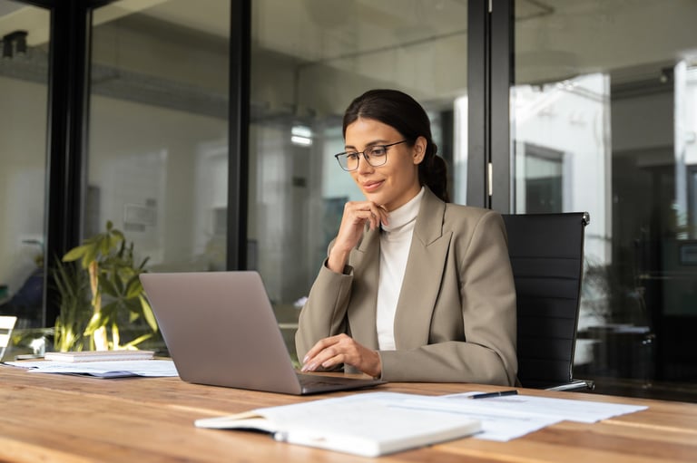 Professional business woman working on laptop representing self-employed entrepreneurs and freelancers