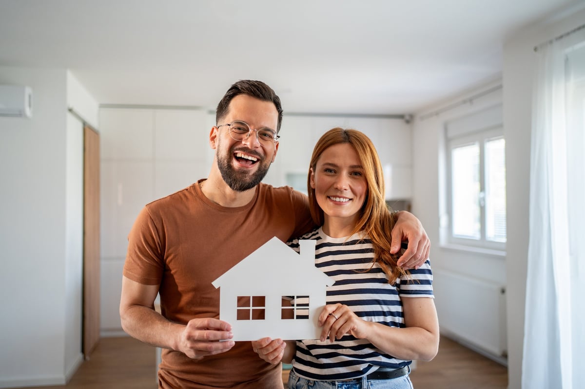 Happy couple celebrating their new home