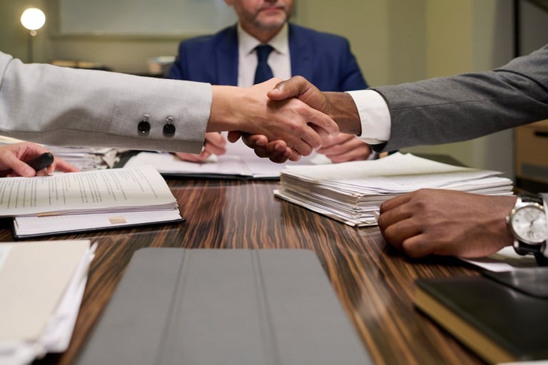 Business handshake during loan negotiation representing alternative lending and private financing solutions